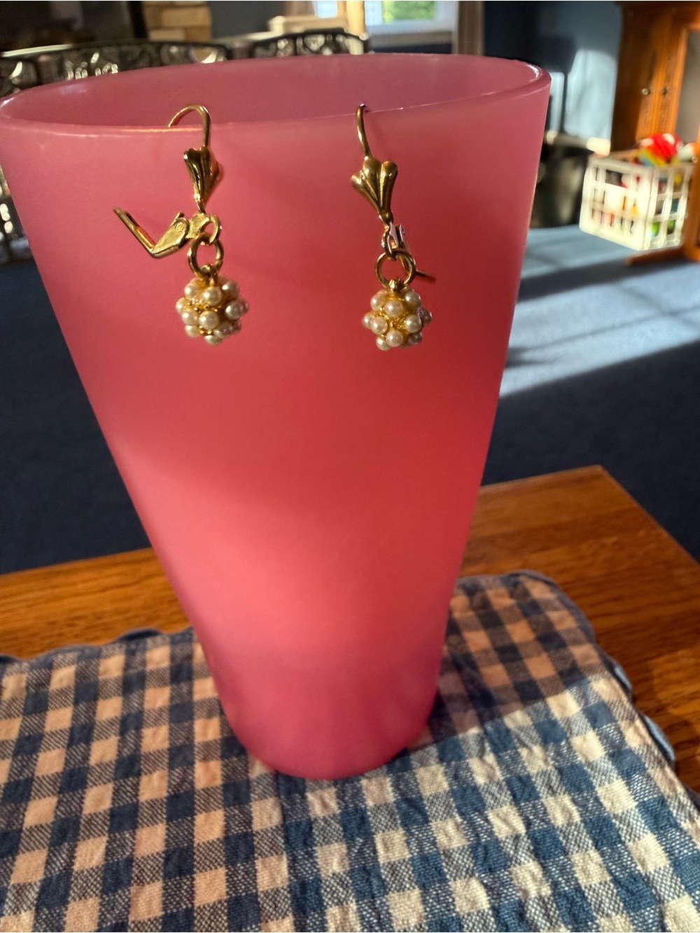 Gold toned drop earrings featuring a delicate, grape-like cluster